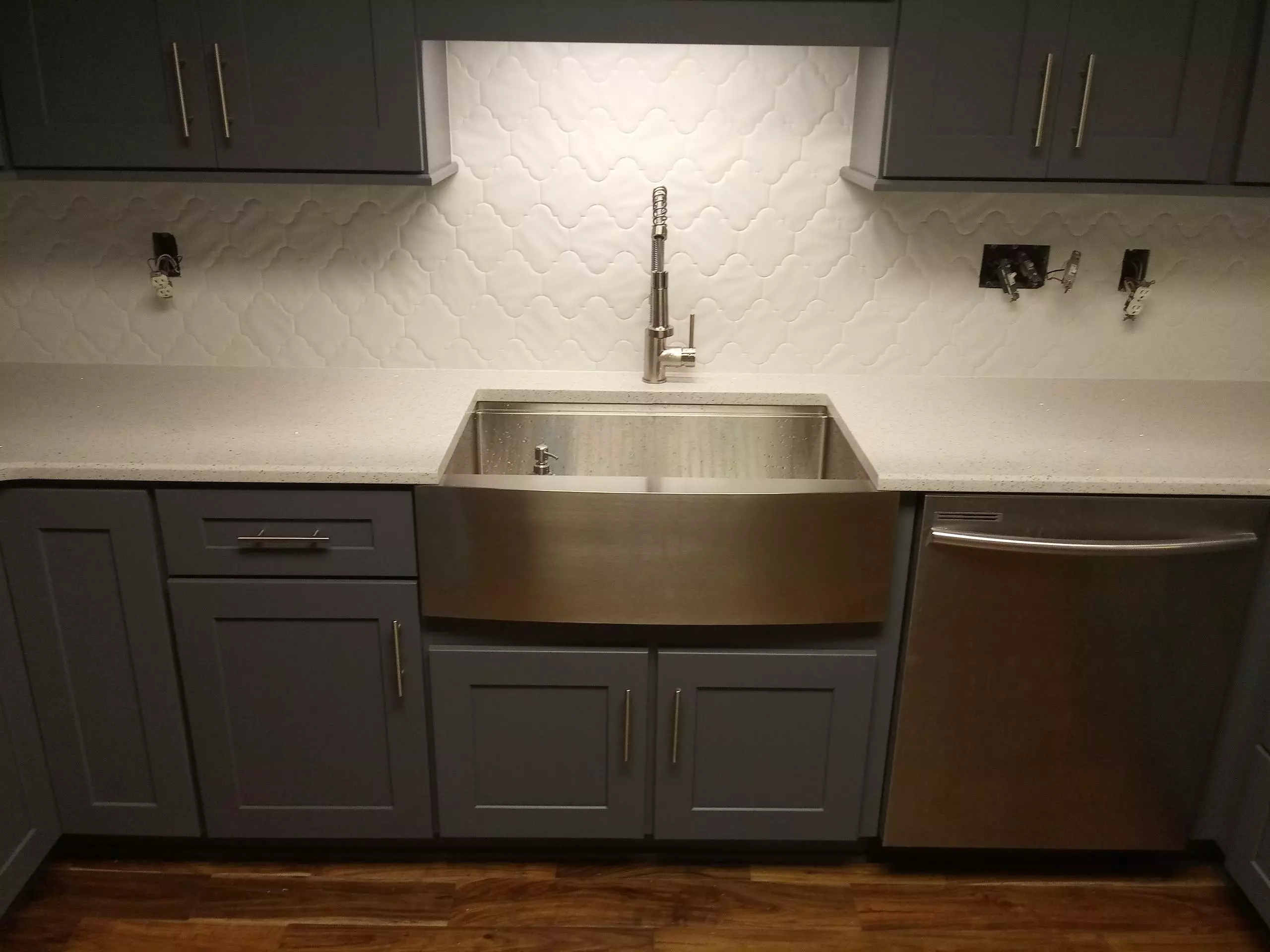 Grey and blue custom kitchen cabinets with silver applicances