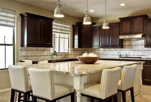 Beautiful white kitchen remodel with dark brown custom cabinets