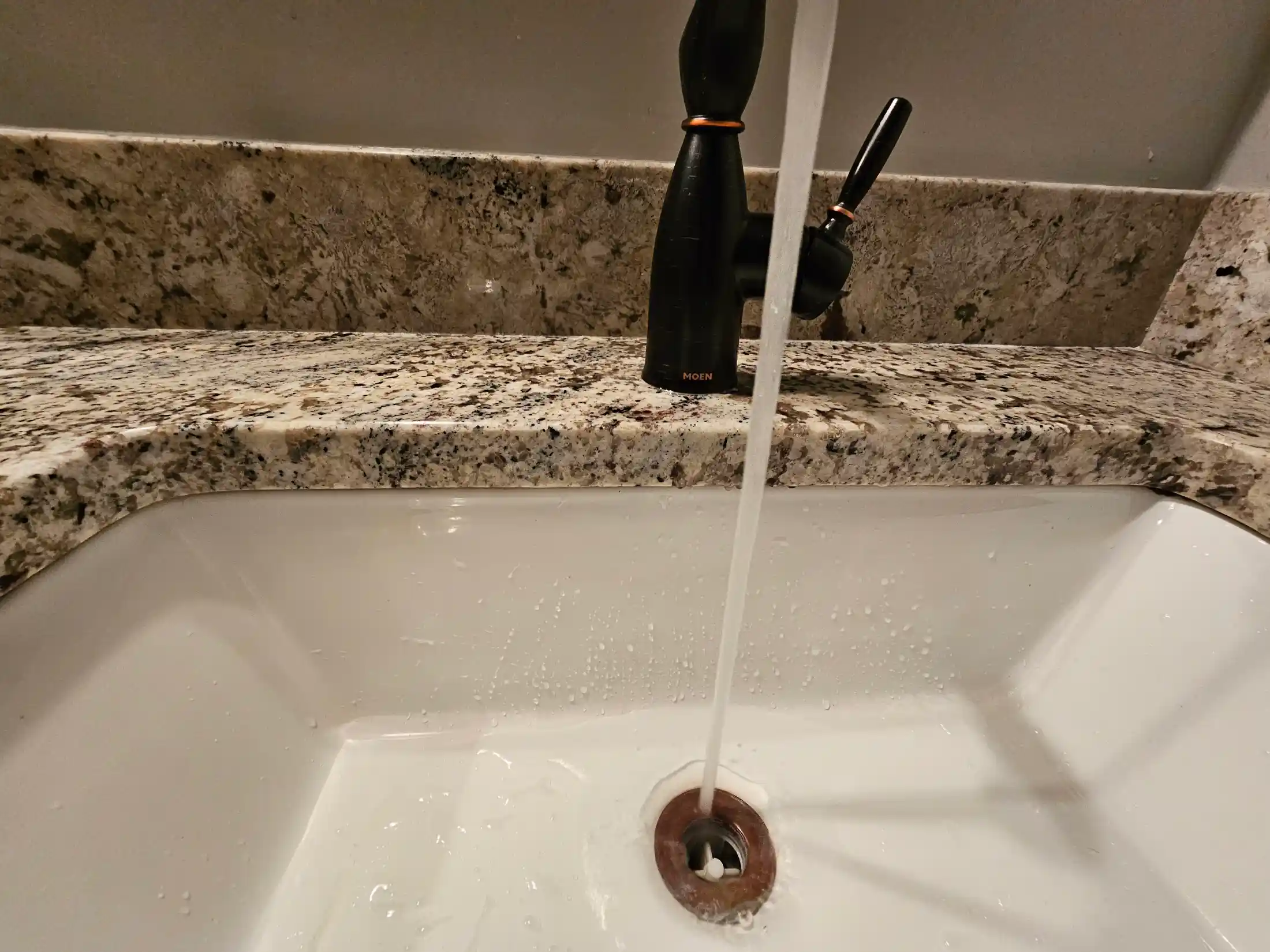 bathroom sink with running water