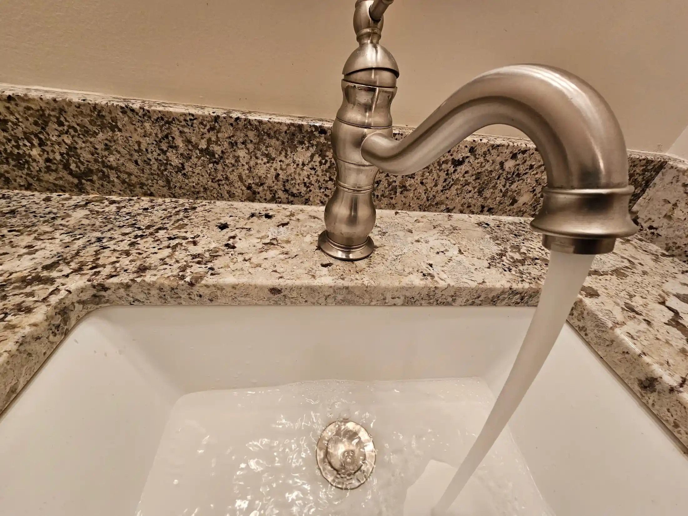 Bathroom sink and silver faucet