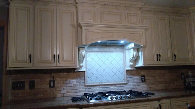 Avalon kitchen cabinets with custom design and custom backsplash