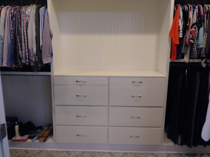 Custom closet remodel with white cabinets