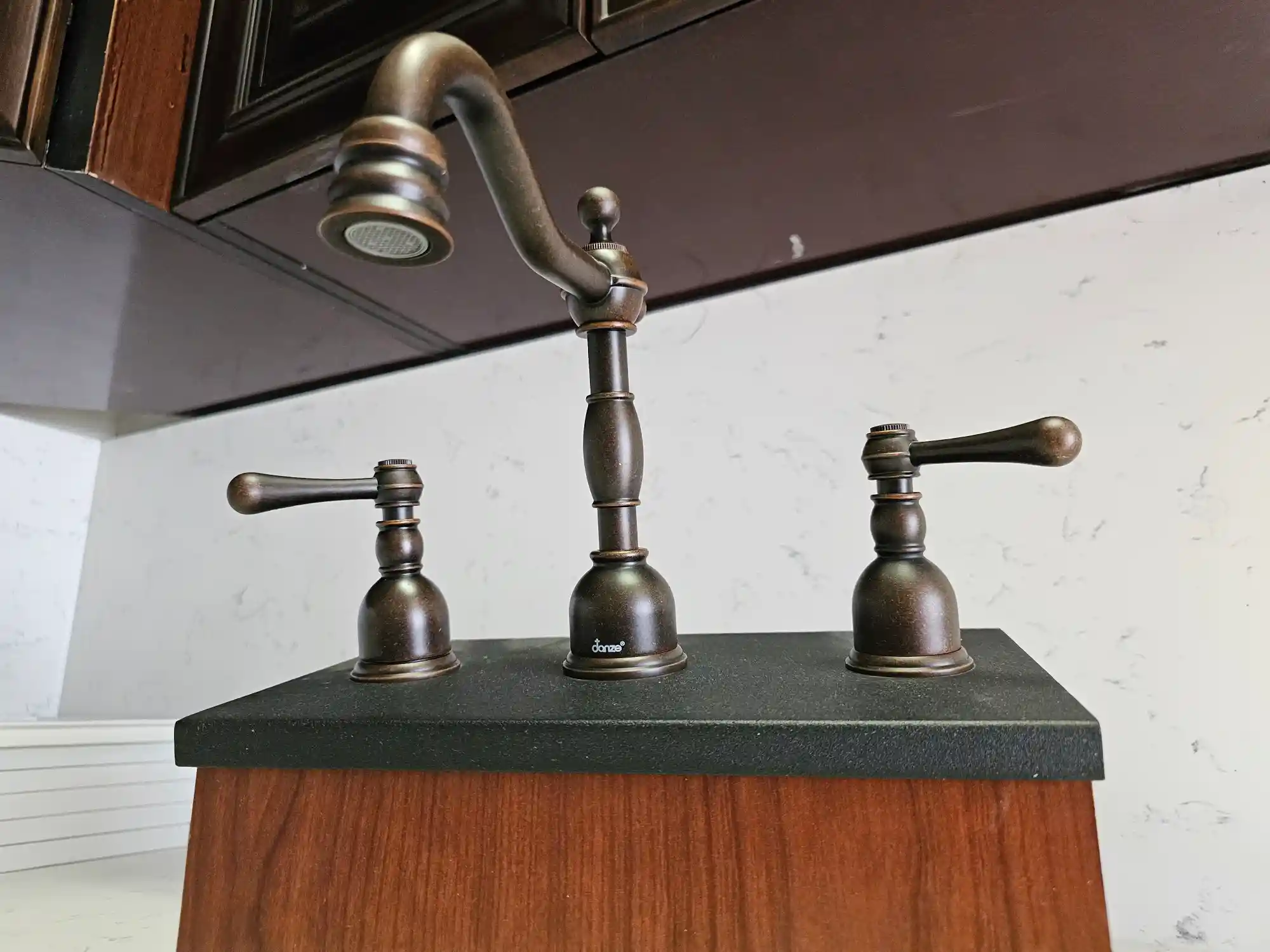 Bronze handles and faucets.