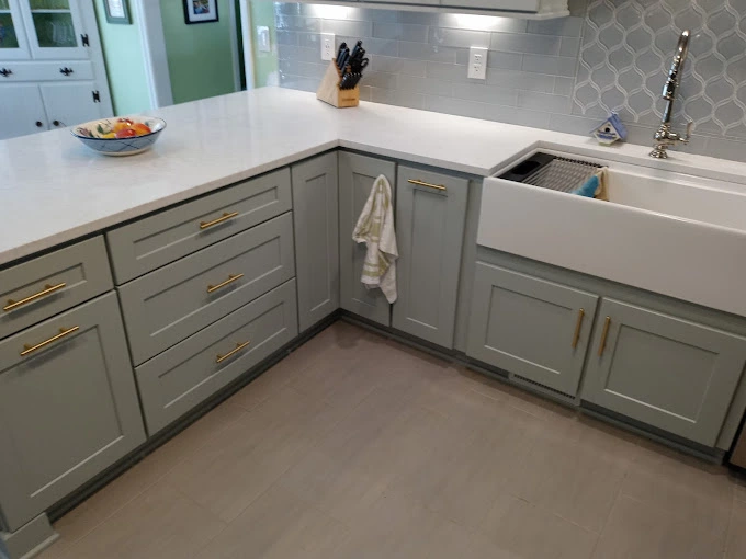 light blue minty custom cabinets with white marble countertop