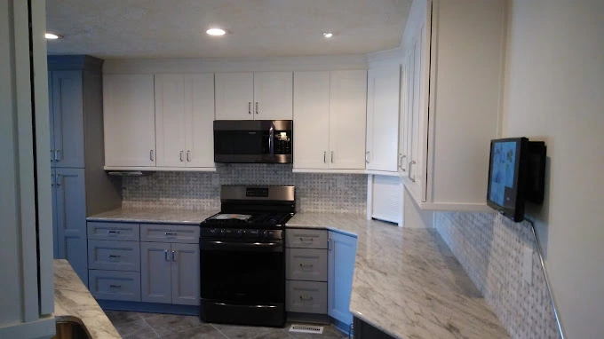 White kitchen cabinets with beautiful countertop near Southern Pines NC