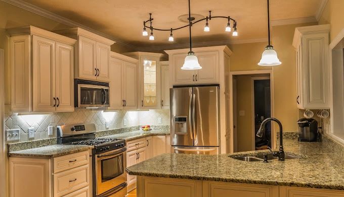 Beautiful custom kitchen with light fixtures and and new applicances