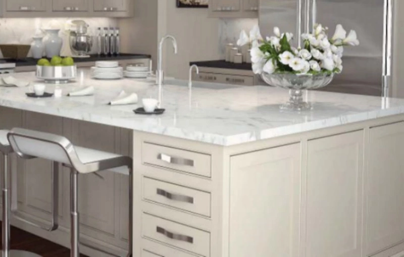 White marble kitchen countertop with kitchen chairs and flowers in Fayetteville NC